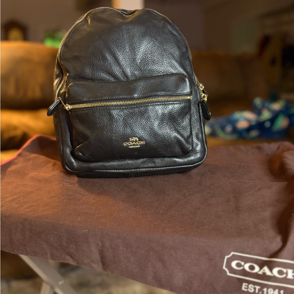 Coach Black Leather Men's Backpack with Gold Accents
